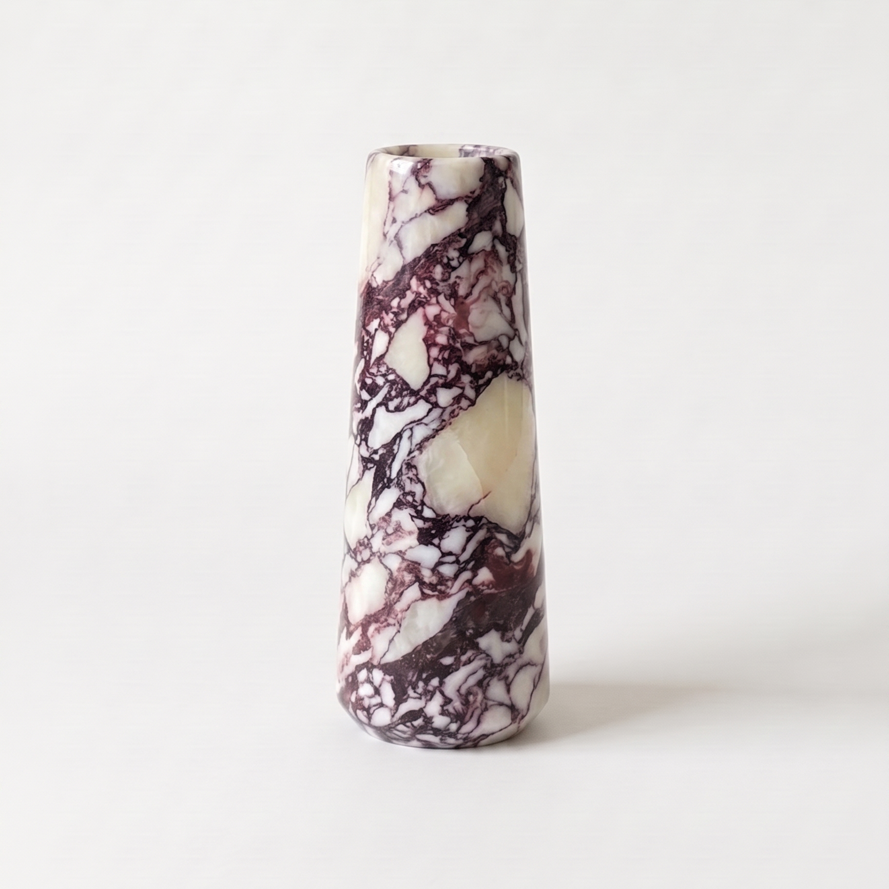 Calacatta Viola Marble vase on a white background