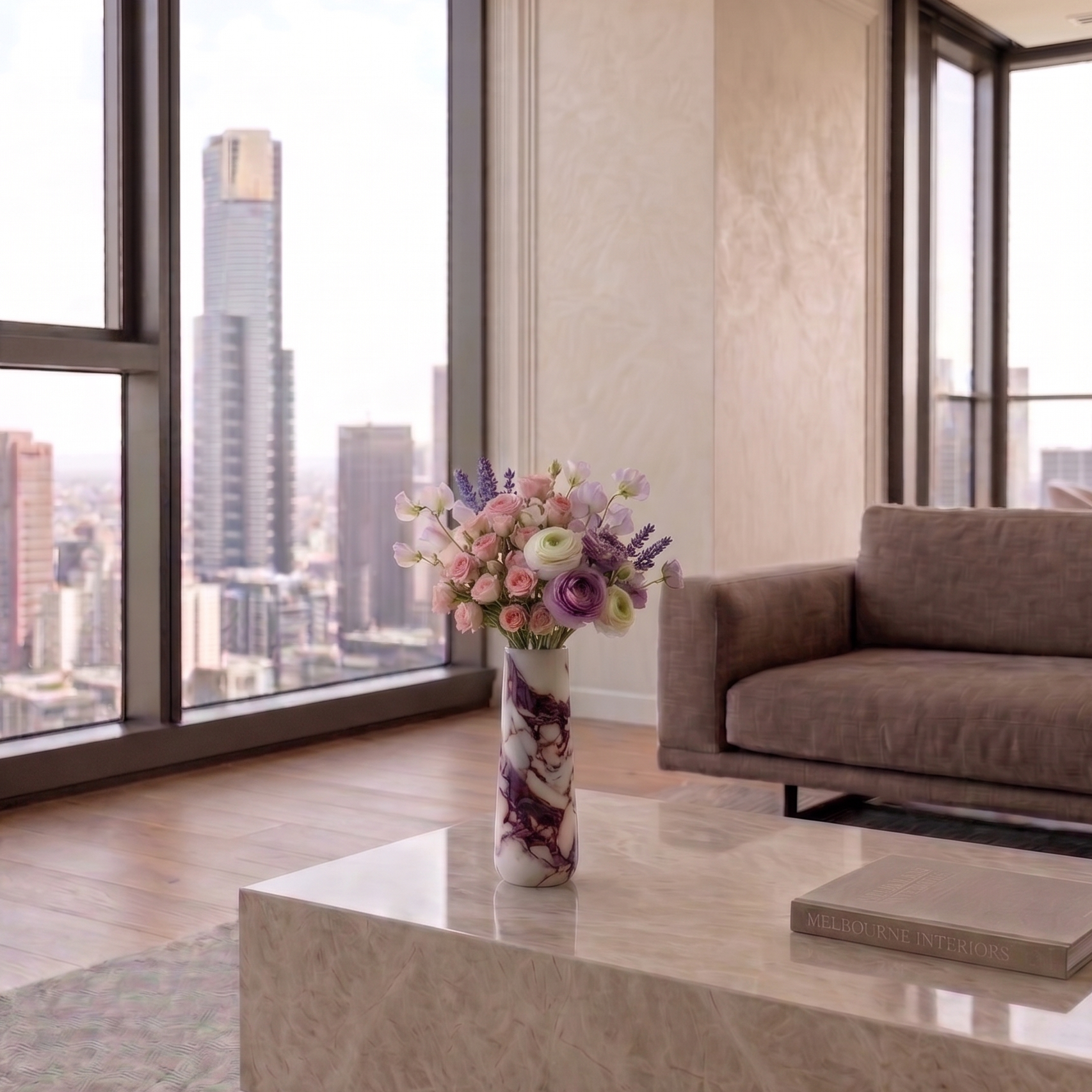 Modern living room with a cityscape view, calacatta viola marble flower vase on a table, and a sofa.